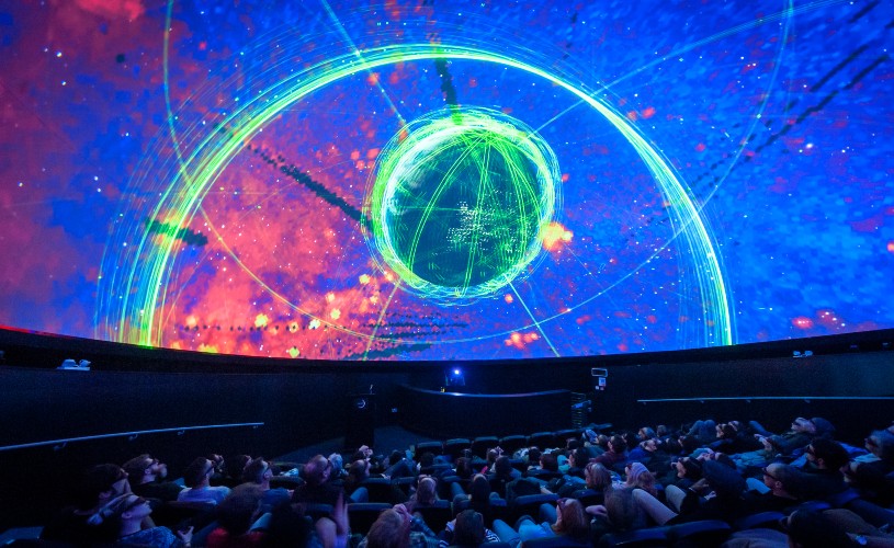 Audience looking up at planetarium at We The Curious